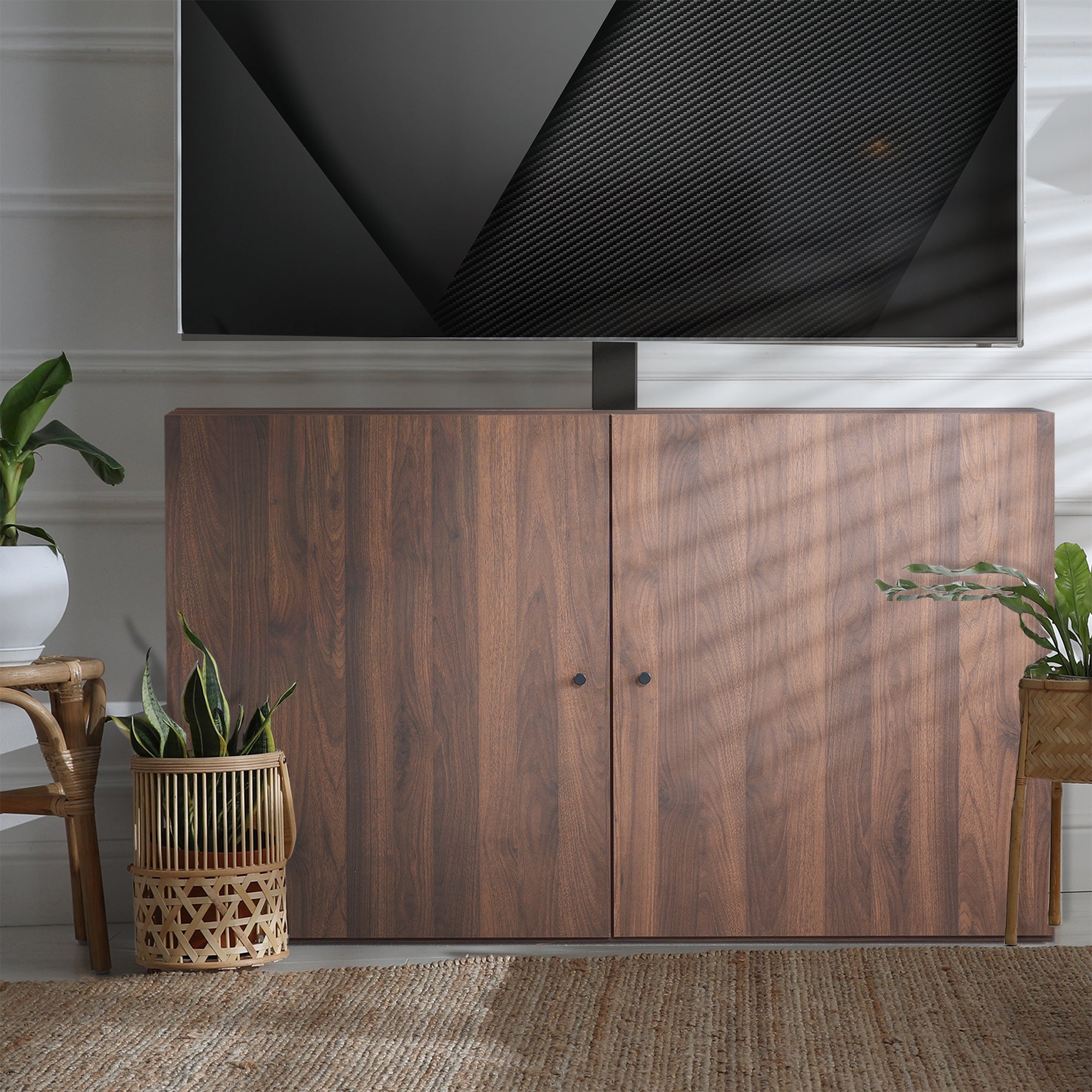 A walnut brown TV lift cabinet with a flat-screen TV mounted on top.
