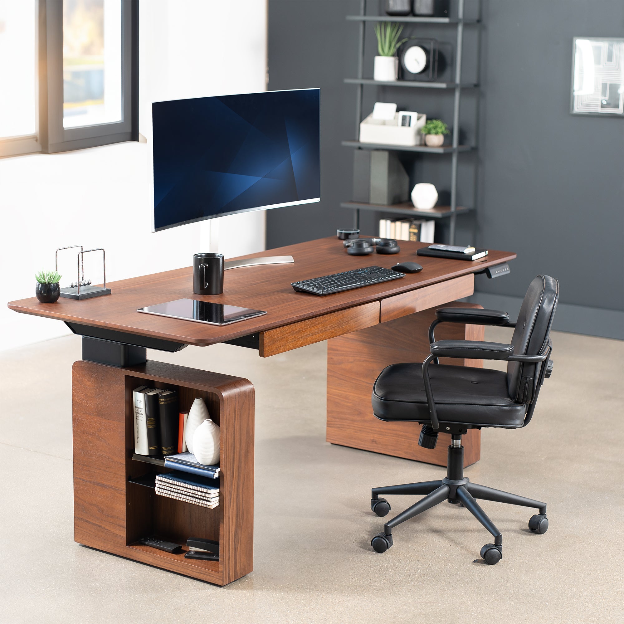 Spacious sit to stand walnut executive desk with two pull-out drawers, adjustable shelving on the reversible legs, and a built-in power strip for convenient connectivity.