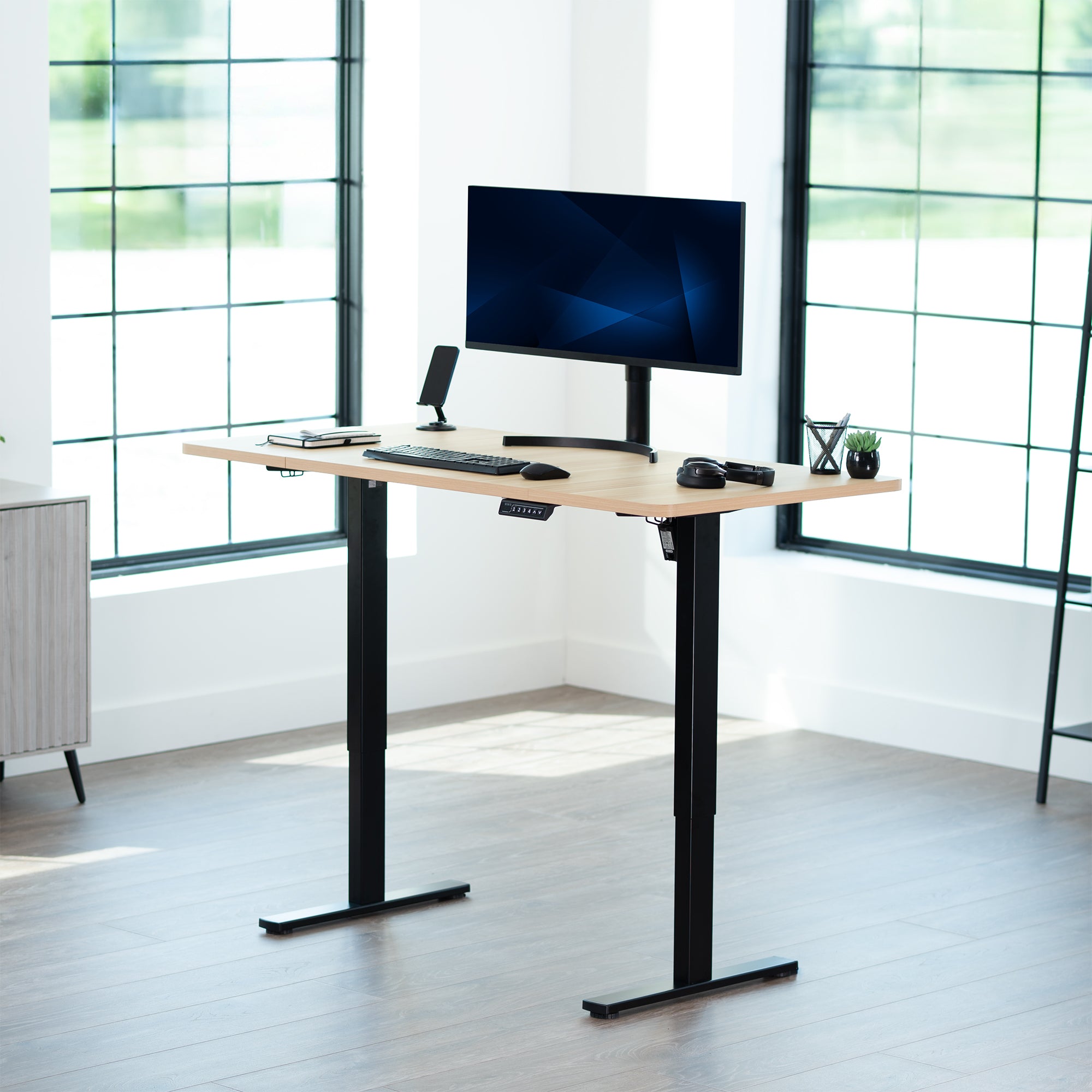 Sturdy ergonomic sit or stand active desk workstation with adjustable height using smart control panel.