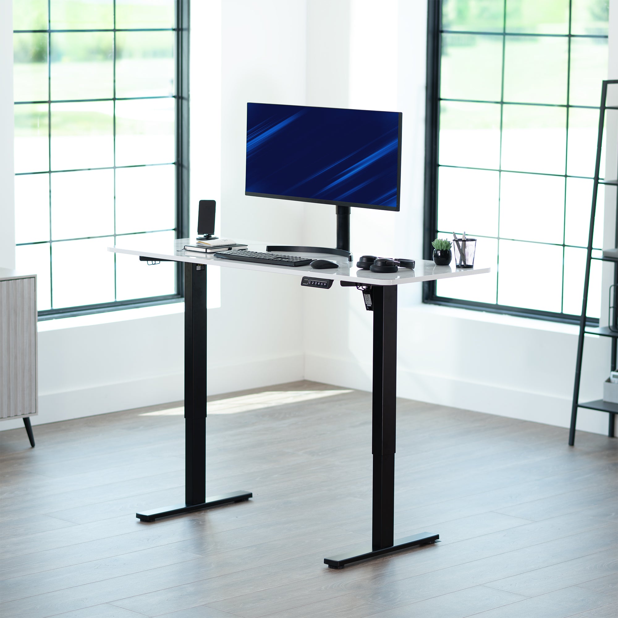 Sturdy ergonomic sit or stand active desk workstation with adjustable height using smart control panel.