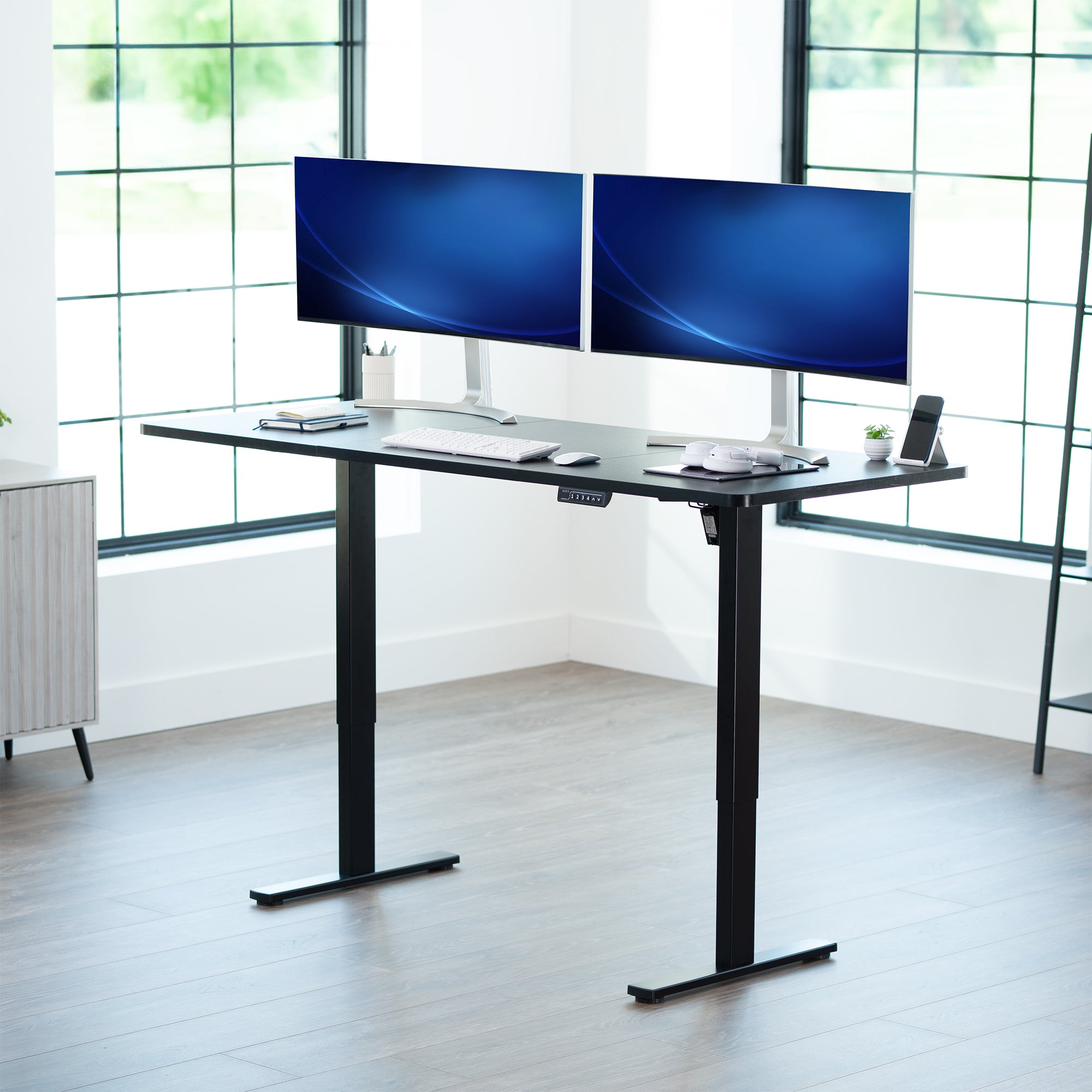 Large sturdy sit or stand modern desk with electric height adjustment options.