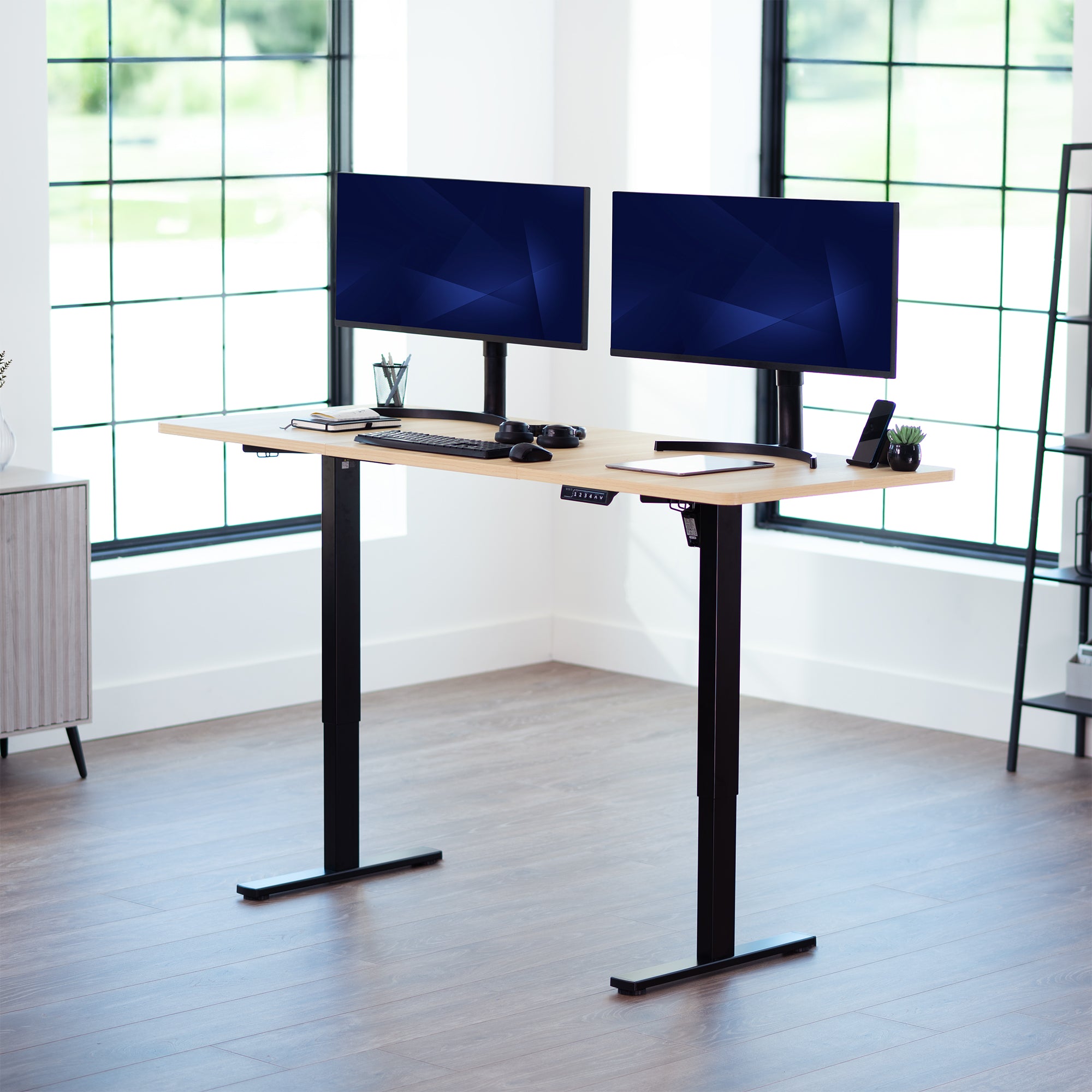 Large sturdy sit or stand modern desk with electric height adjustment options.
