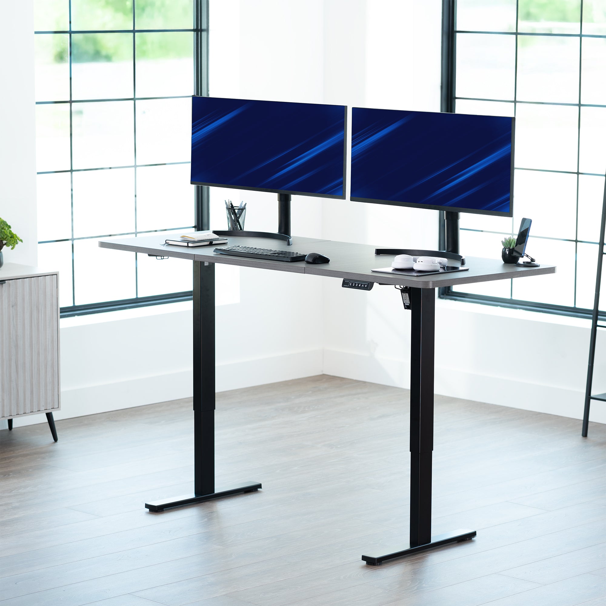Large sturdy sit or stand modern desk with electric height adjustment options.