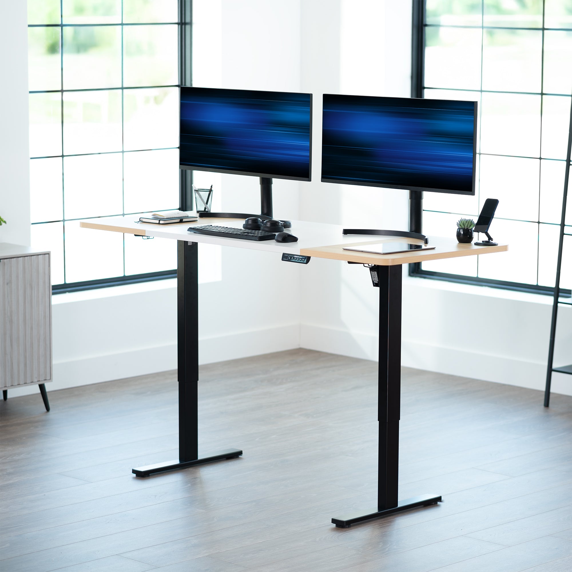 Large sturdy sit or stand modern desk with electric height adjustment options.