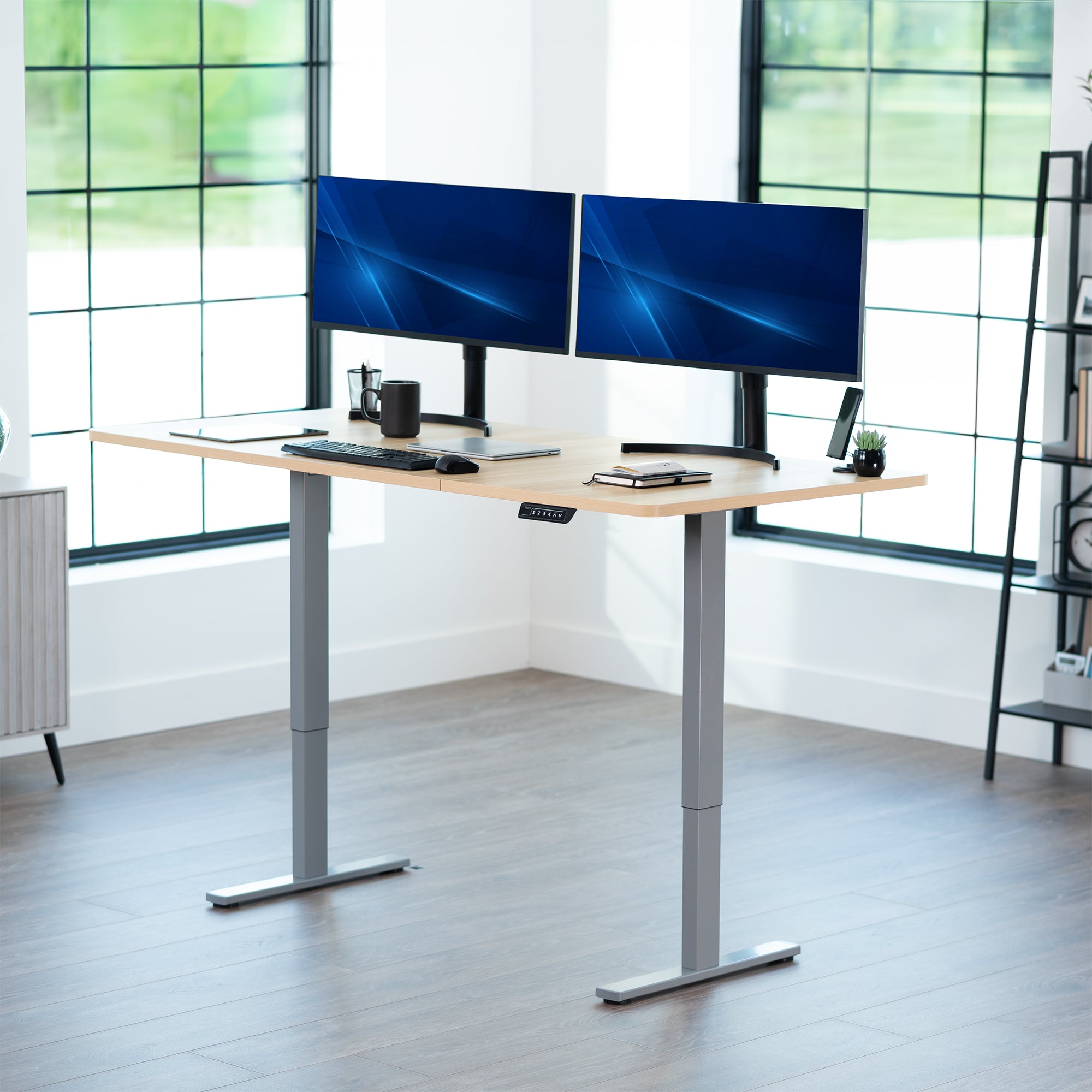 Large sturdy sit or stand modern desk with electric height adjustment options.