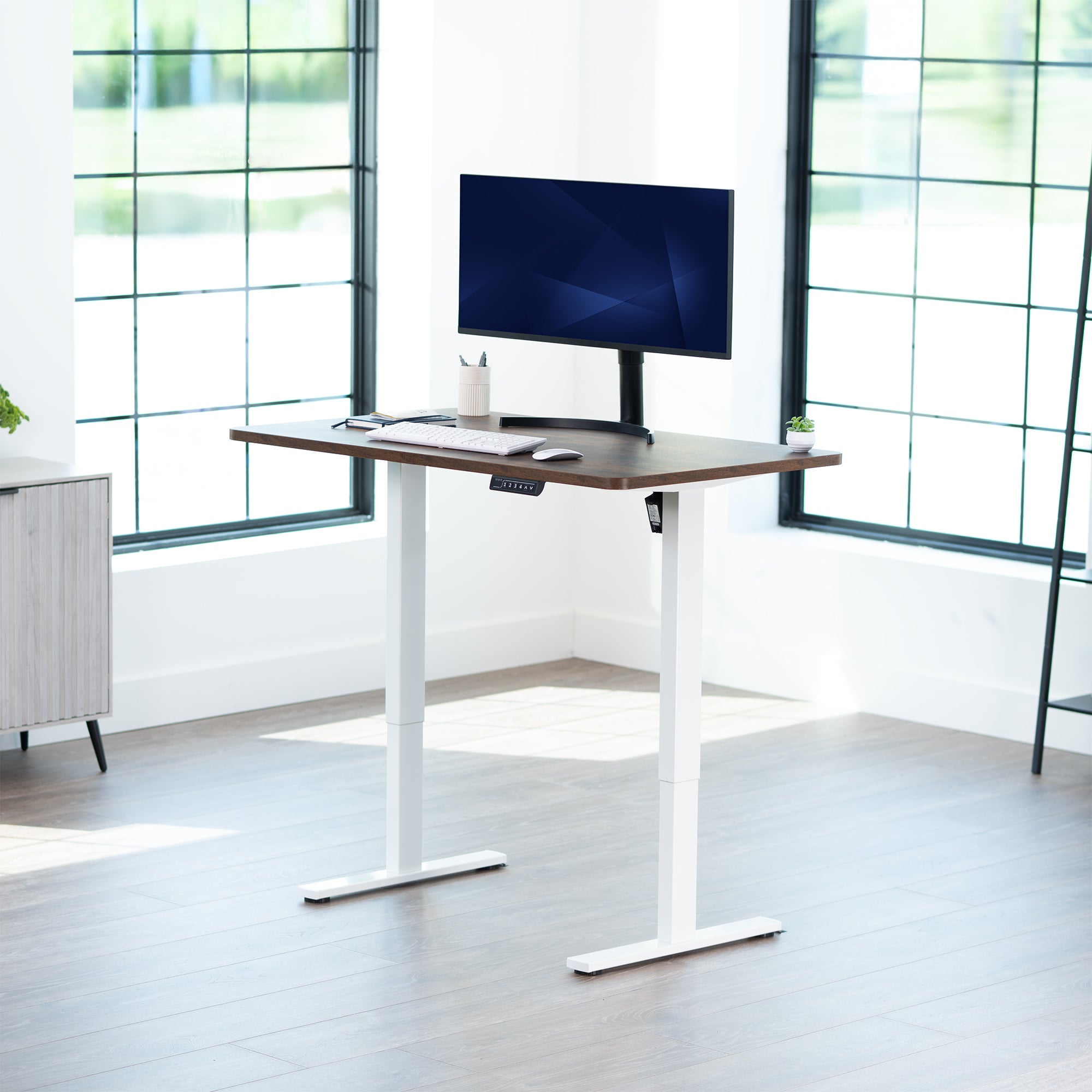 Sturdy ergonomic sit or stand active desk workstation with adjustable height using smart control panel.