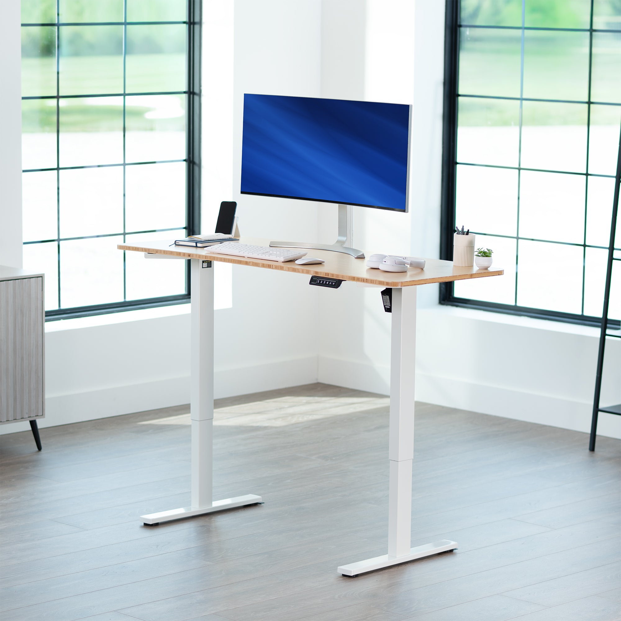 Sturdy ergonomic sit or stand active desk workstation with adjustable height using smart control panel.
