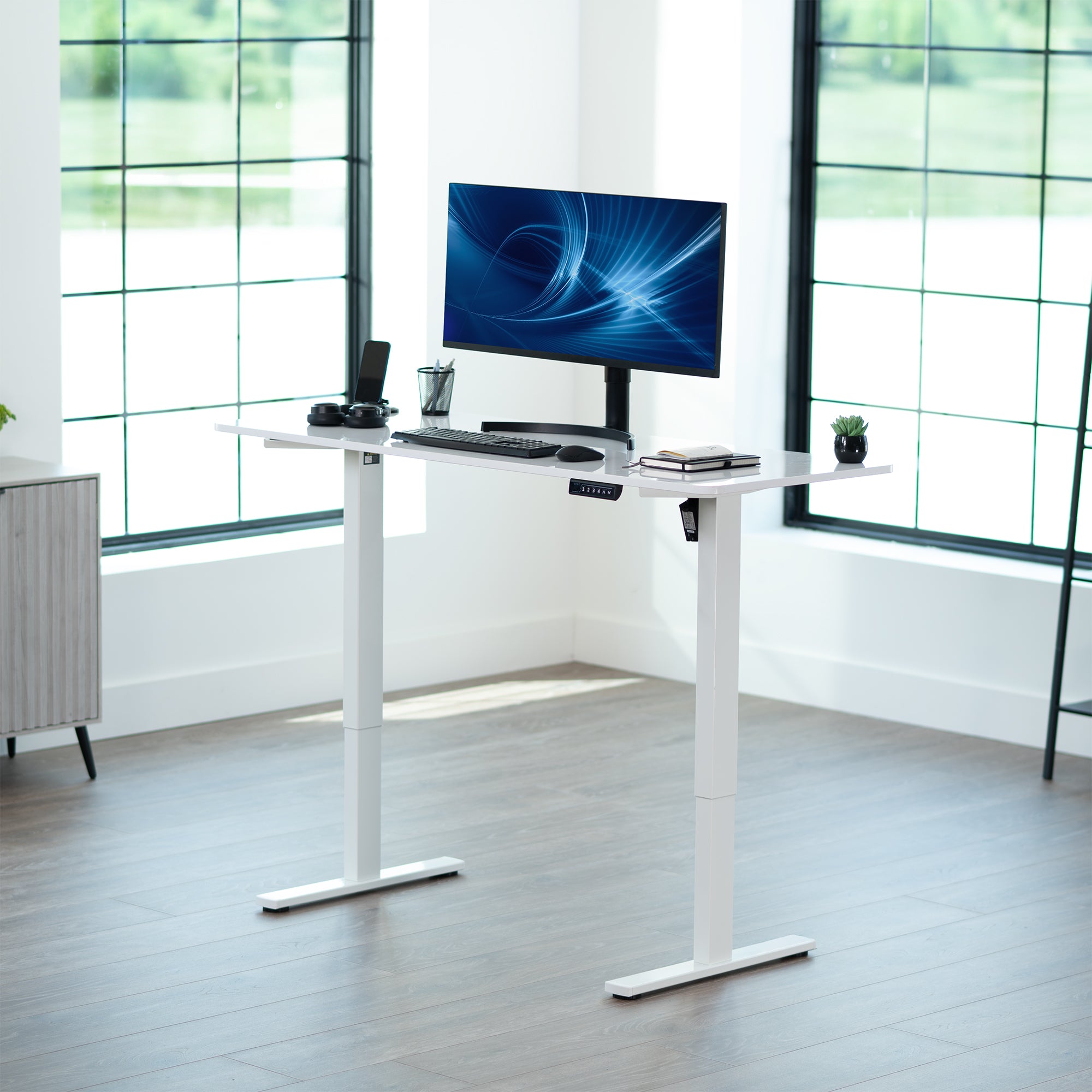 Sturdy ergonomic sit or stand active desk workstation with adjustable height using smart control panel.