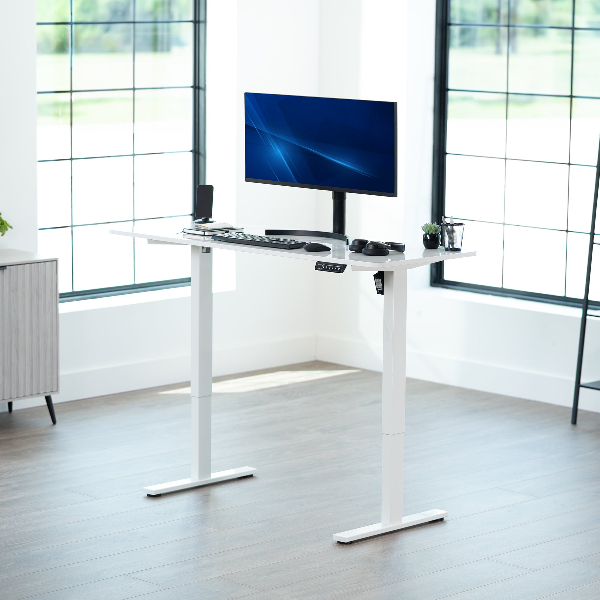 Sturdy ergonomic sit or stand active desk workstation with adjustable height using smart control panel.