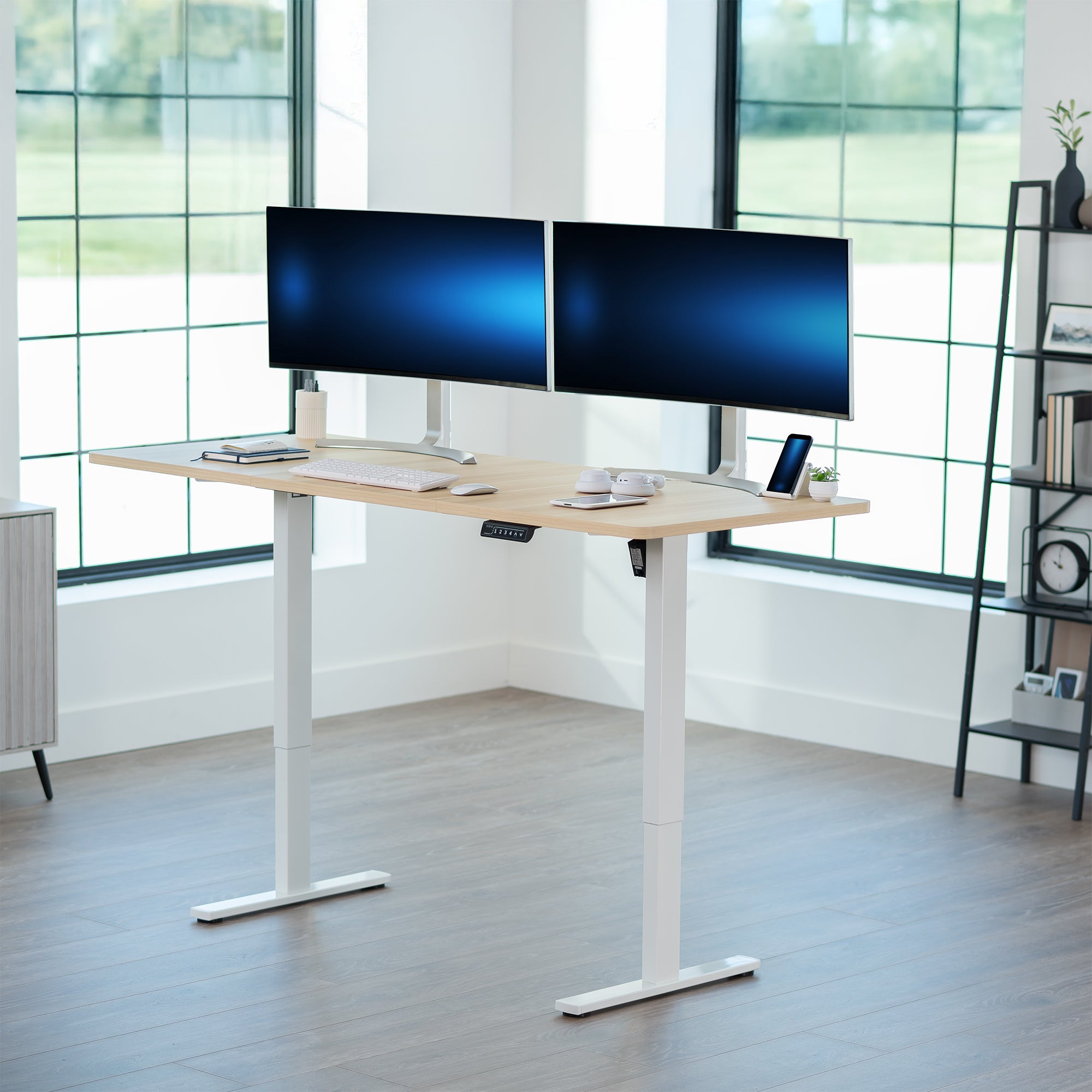 Large sturdy sit or stand modern desk with electric height adjustment options.