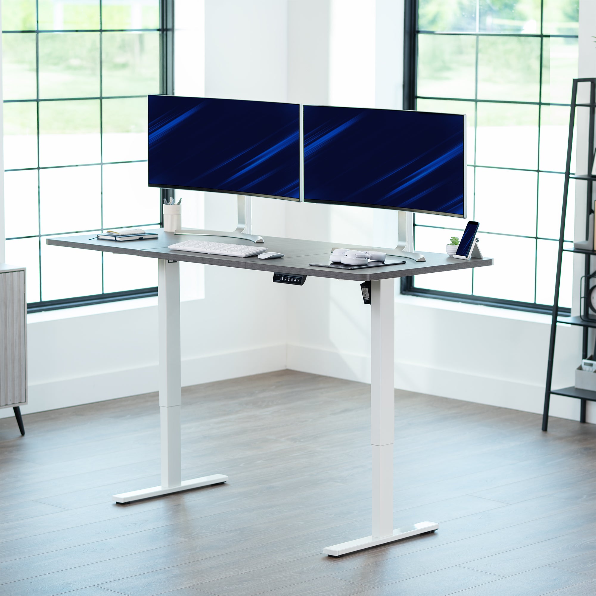 Large sturdy sit or stand modern desk with electric height adjustment options.