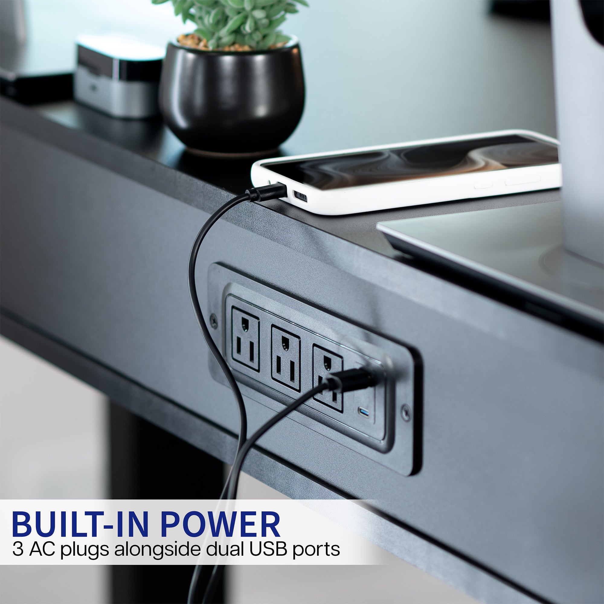 Black shelf with a drawer with built in power outlets.