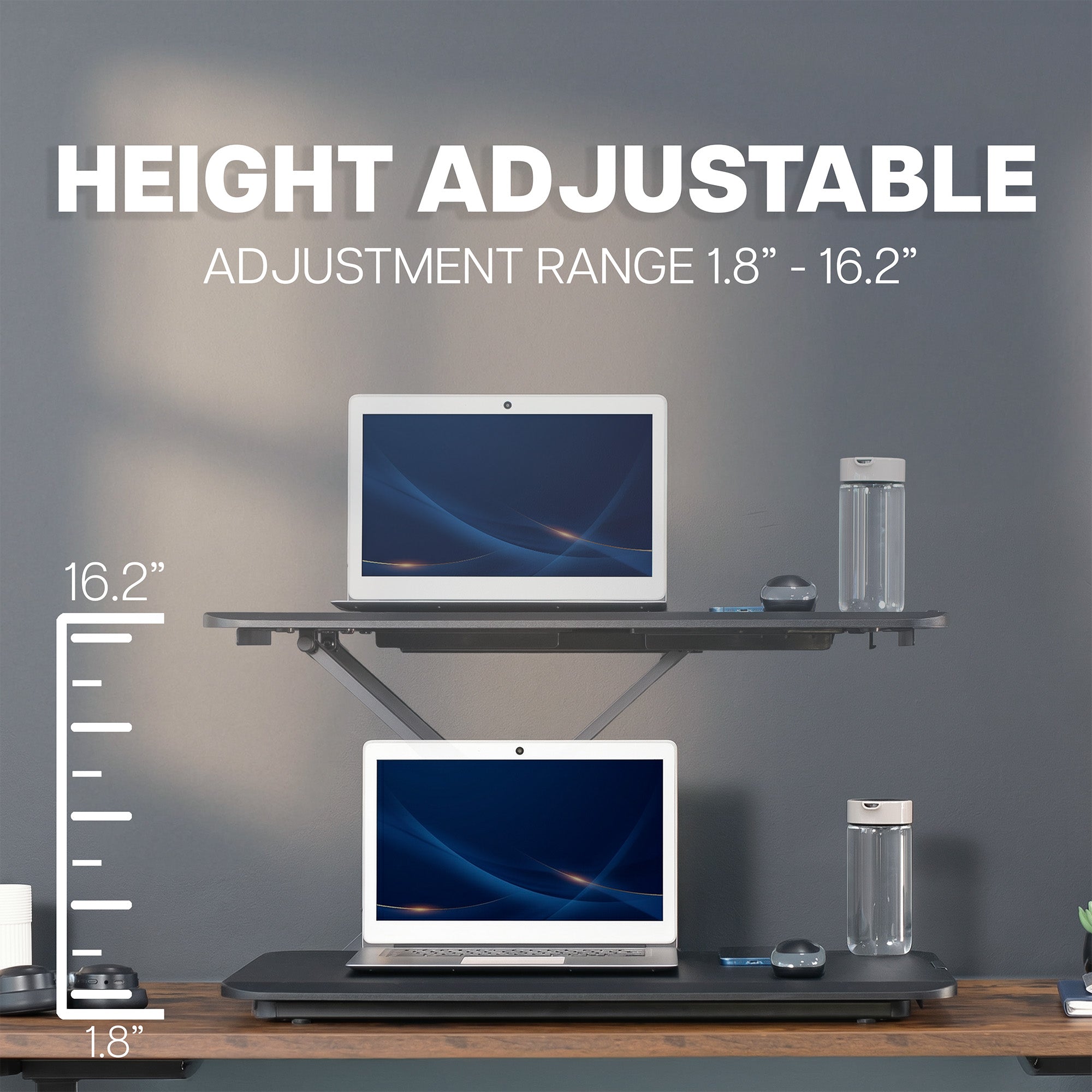 Heavy-duty height adjustable desk converter monitor riser.