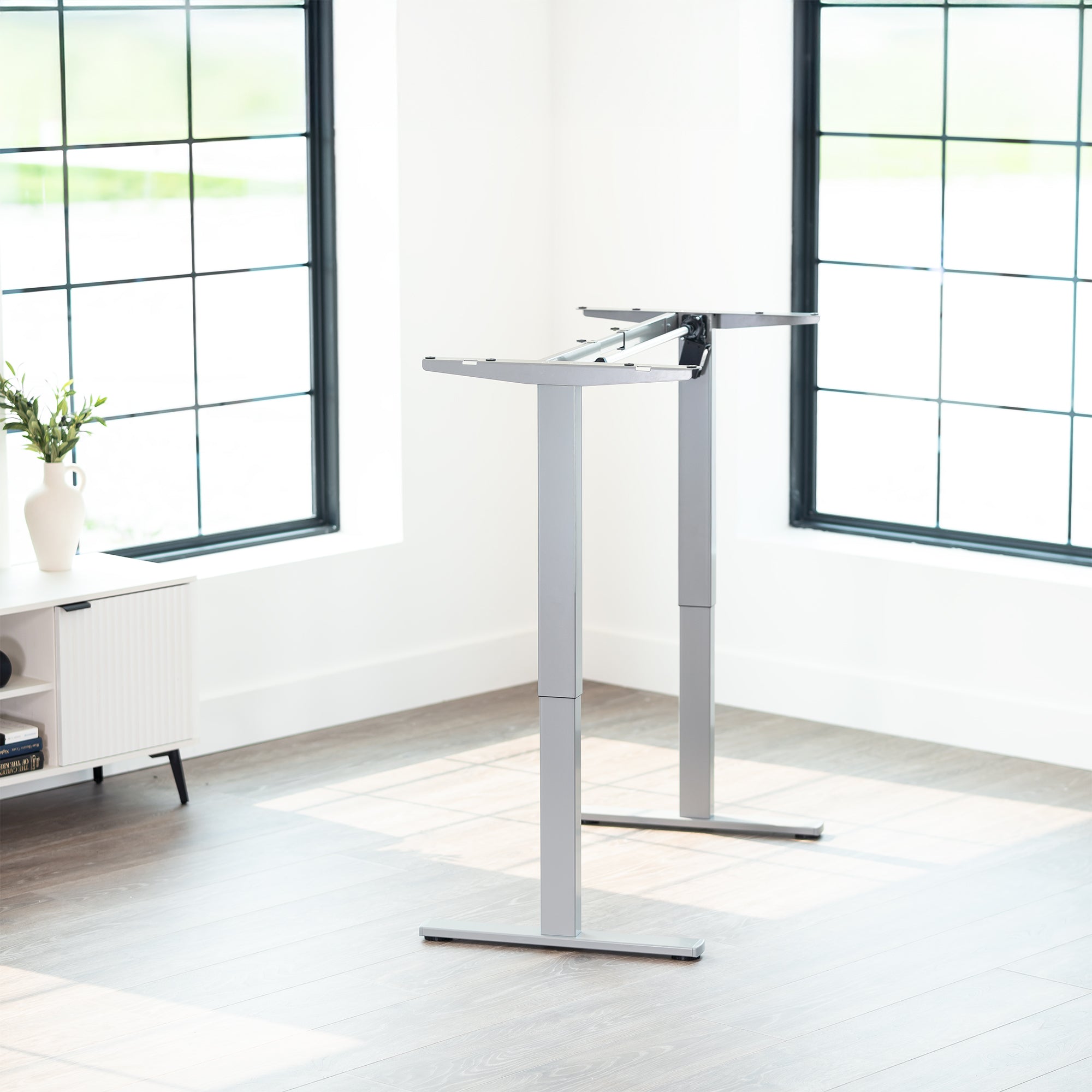 Sturdy ergonomic sit or stand desk frame for active workstation with adjustable height using smart control panel.