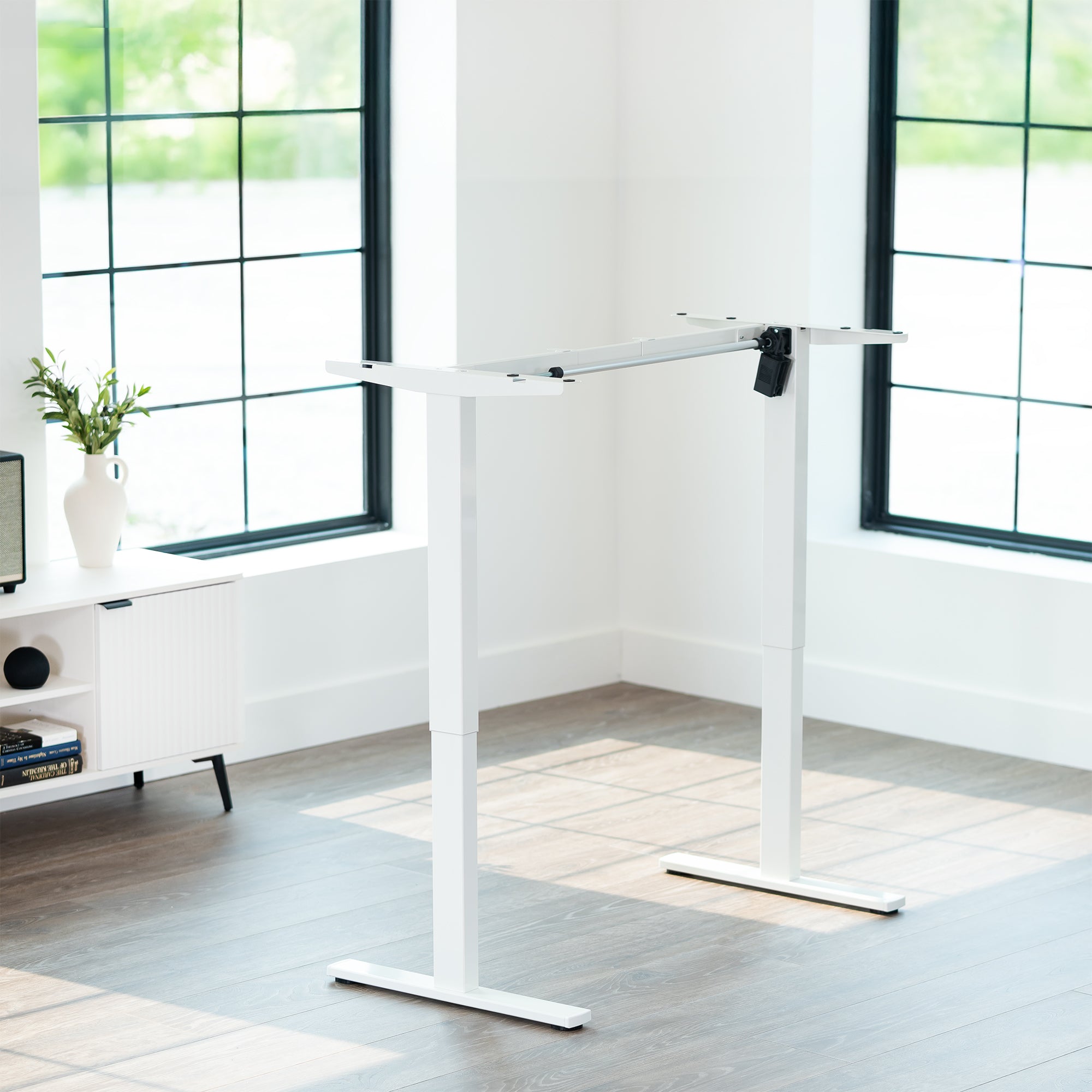 Sturdy ergonomic sit or stand desk frame for active workstation with adjustable height using smart control panel.