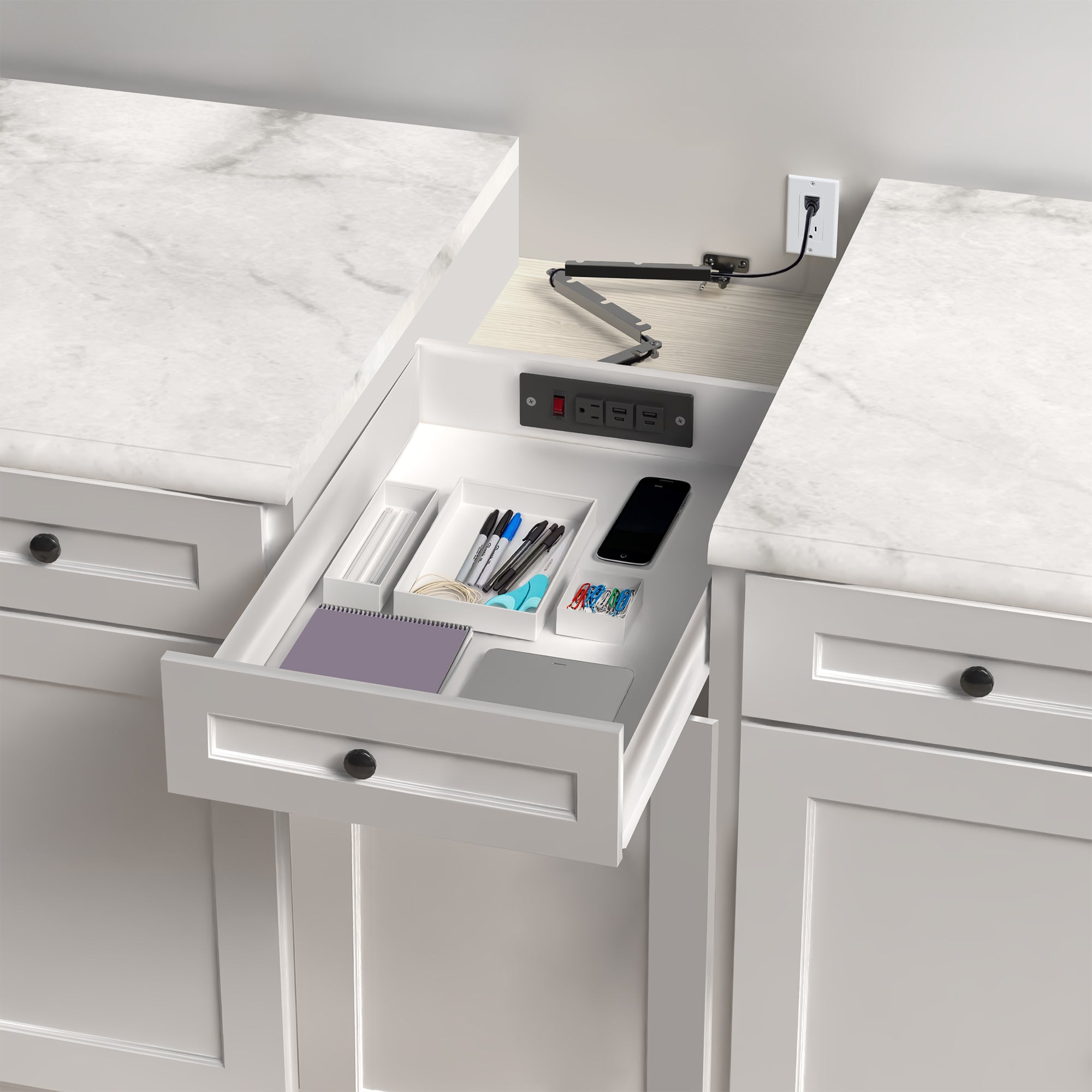 In-drawer charging station with AC outlet and USB ports.