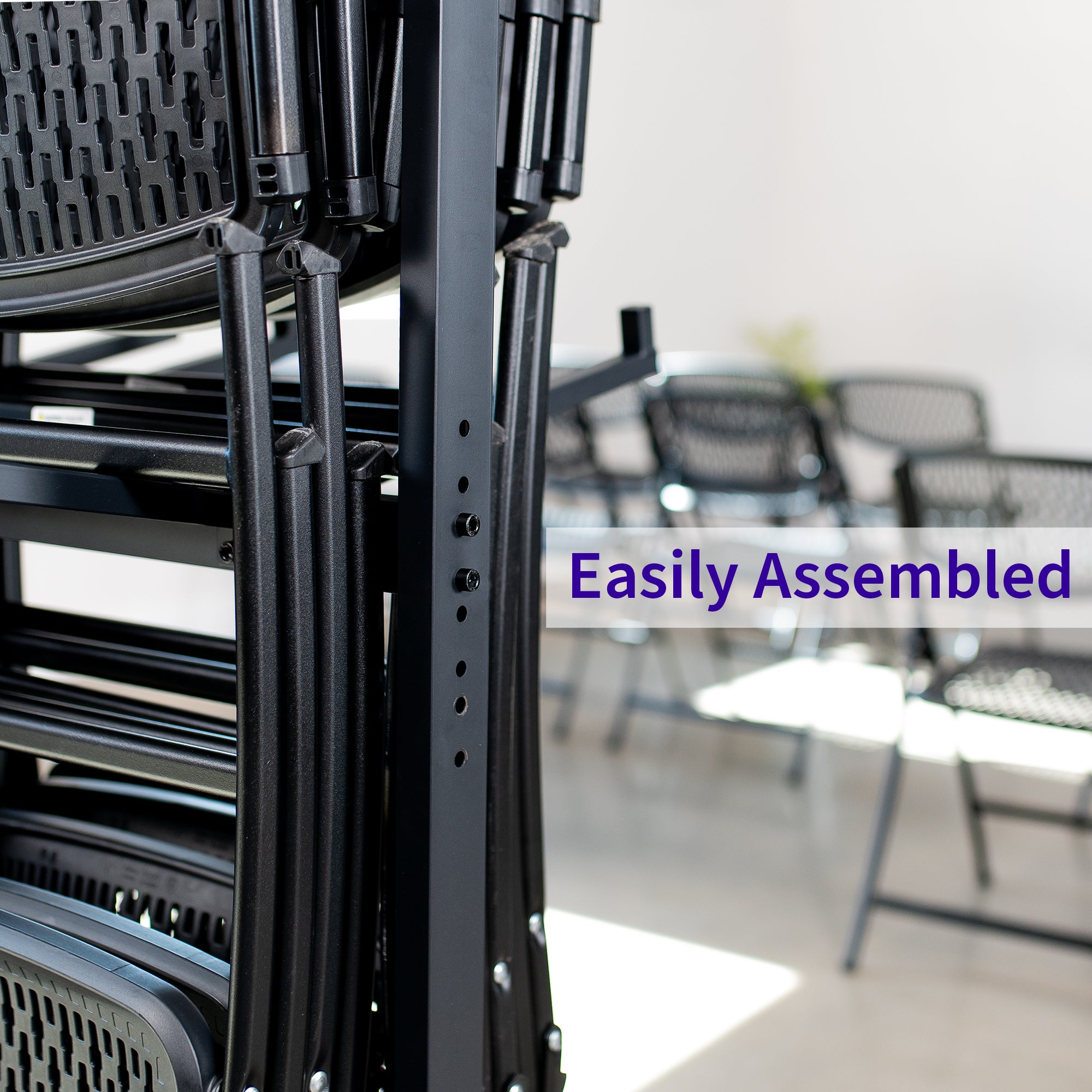 Black metal chair assembly with text in a blurred room setting