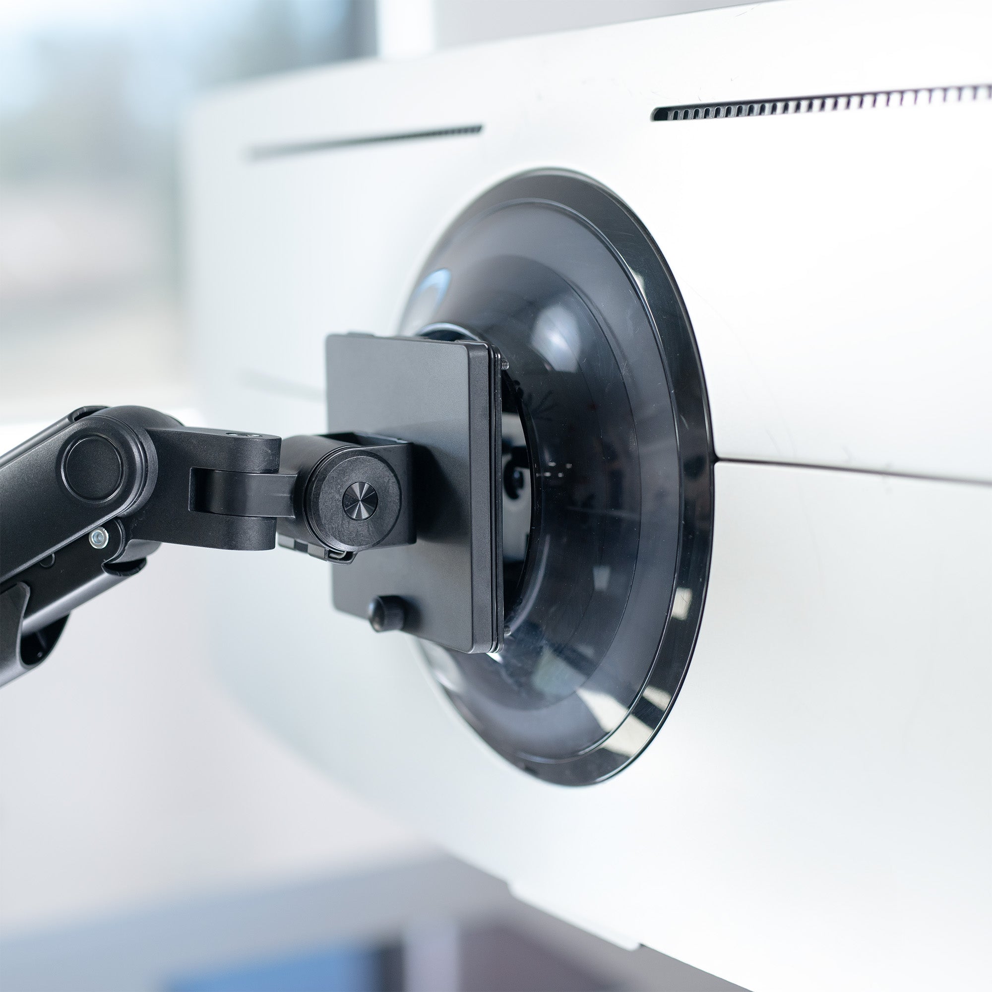 A black VESA adapter designed for a Samsung OLED G9 monitor.