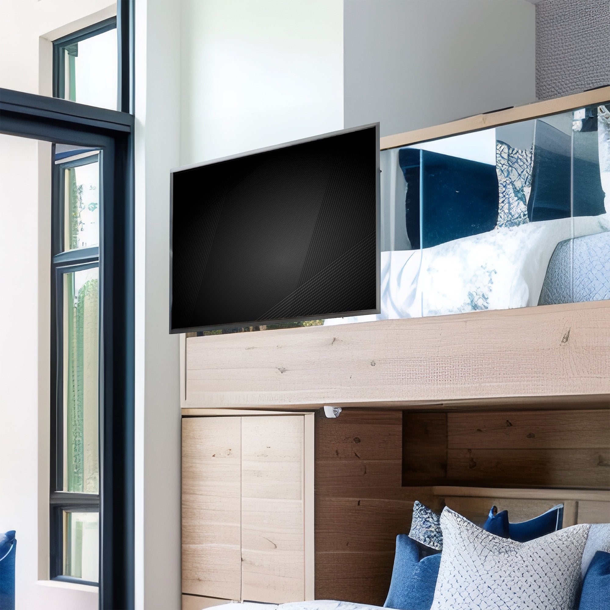 Modern bedroom with a large flat-screen TV mounted