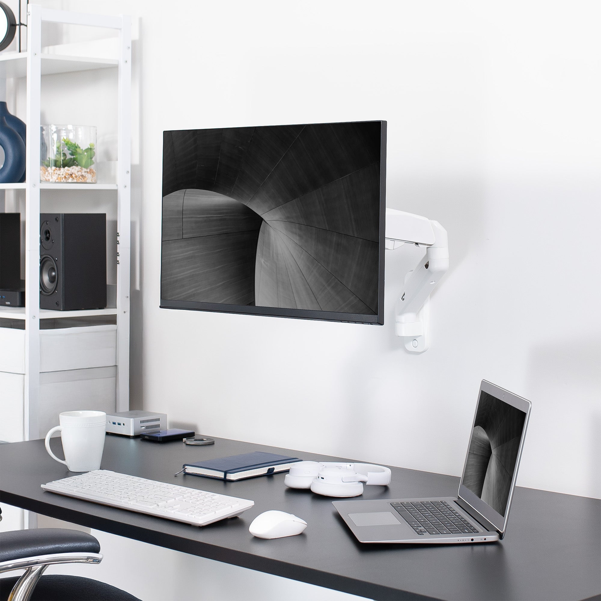 Sturdy adjustable pneumatic arm single monitor ergonomic wall mount that holds screens up to 32" in size.