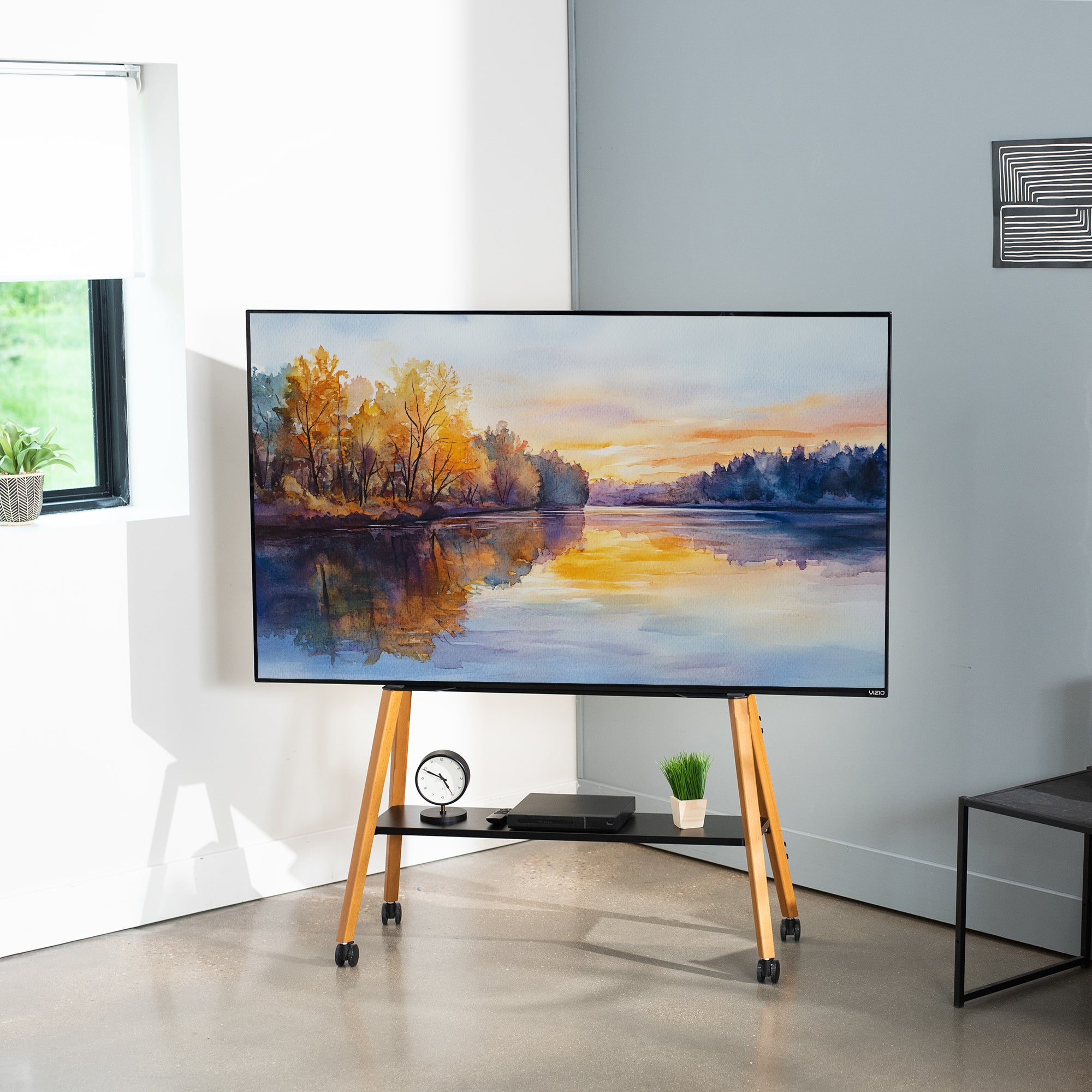 TV on a stand displaying a nature scene in a modern living room.