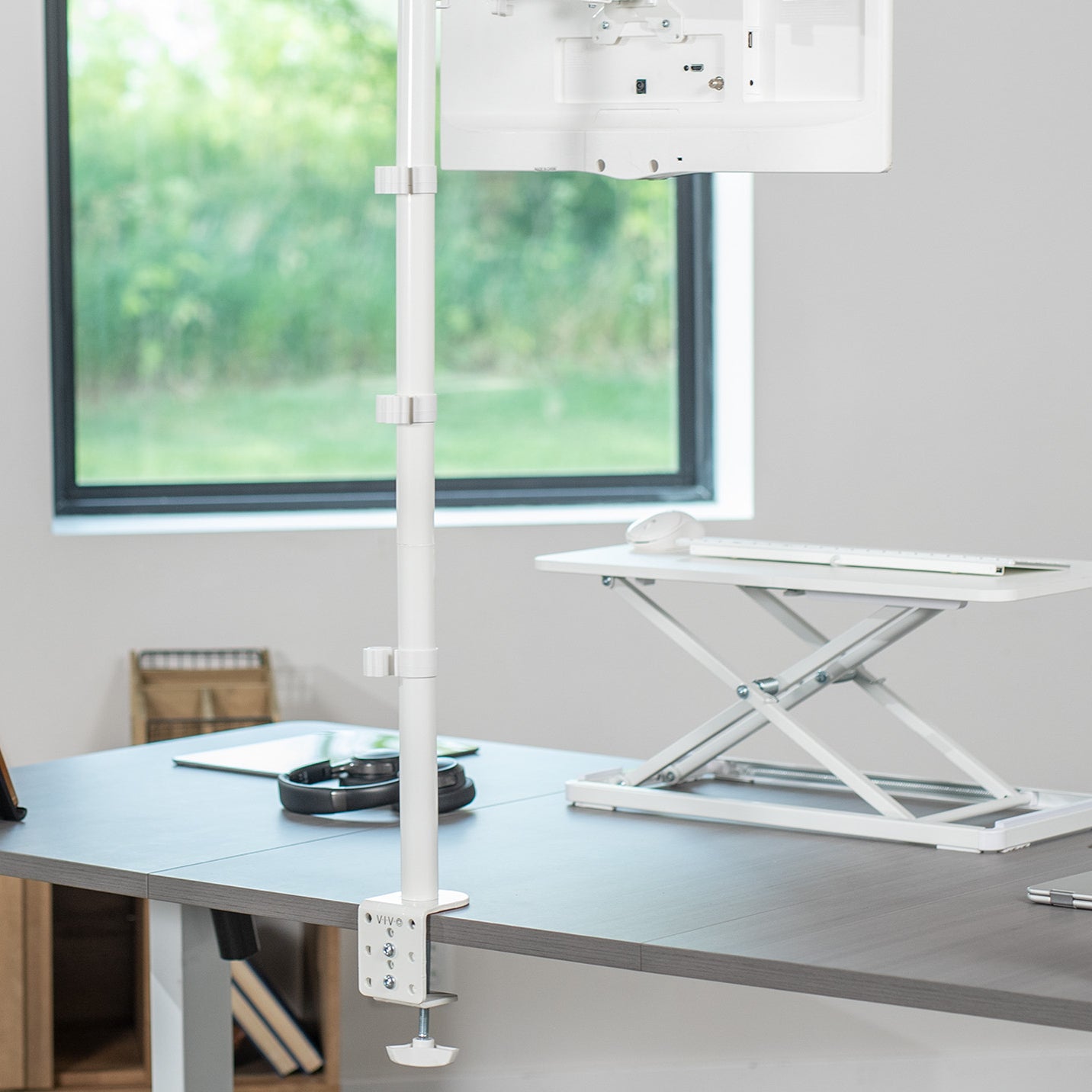 Extra tall desk mount for single monitor provides sit or stand application for the user, flexible viewing angles, and tall screen placement.