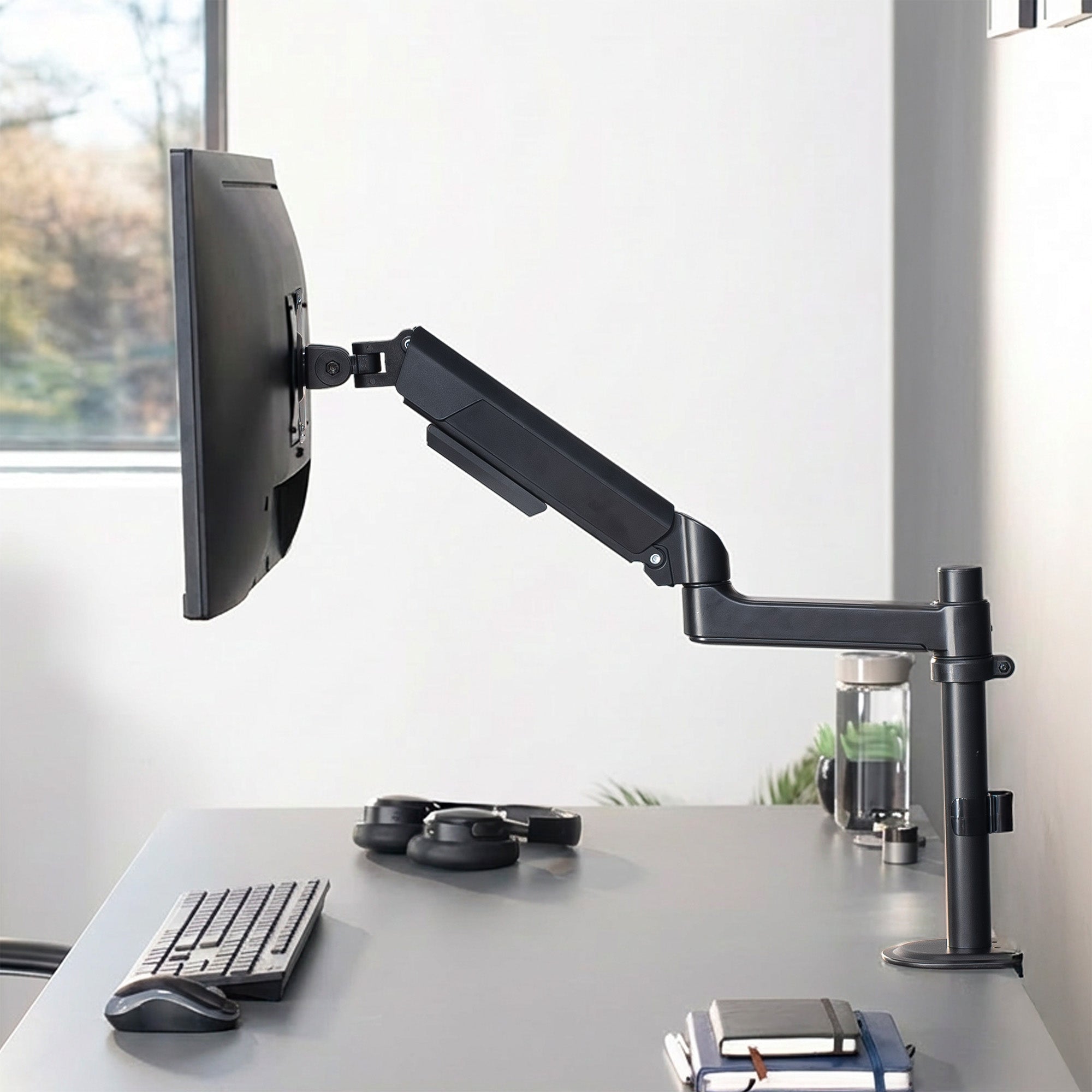 Sturdy adjustable pneumatic arm single monitor ergonomic desk mount for office workstation.