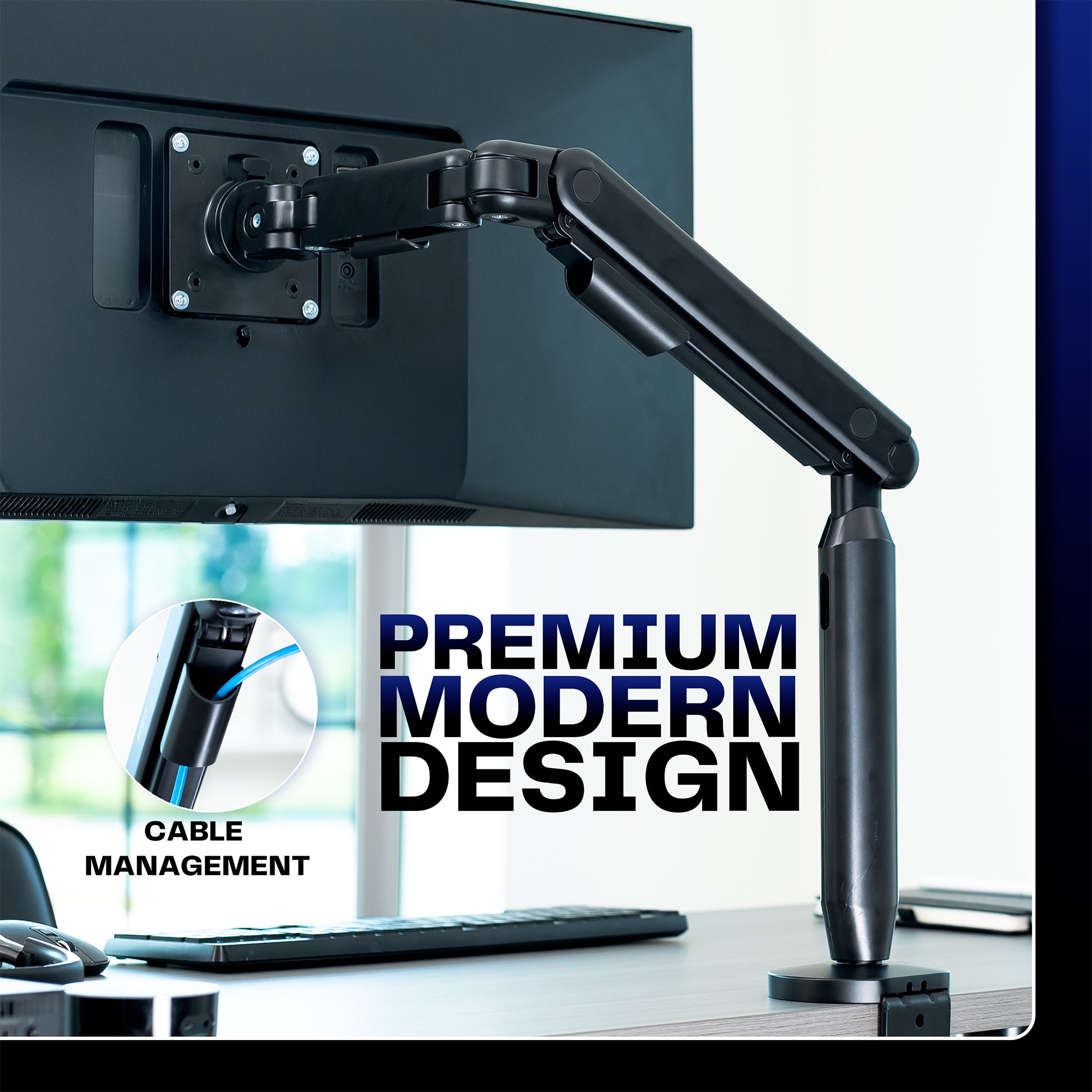 Monitor arm with cable management feature on a desk setup.