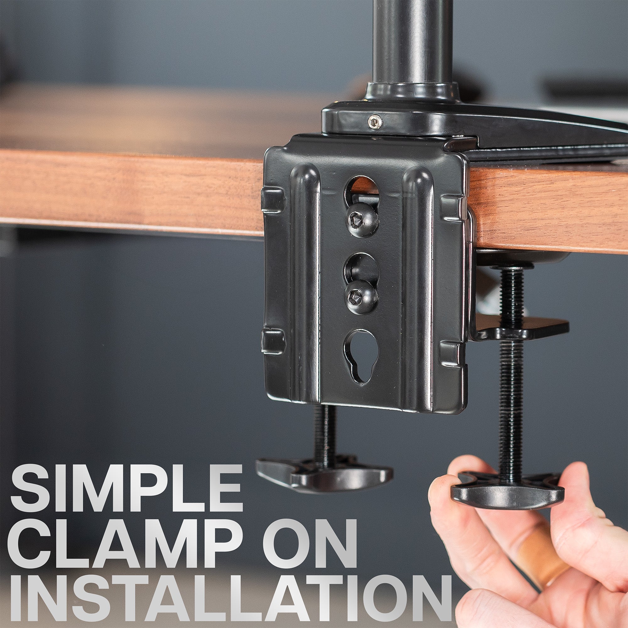 Hand installing a clamp on a wooden desktop with text 'Simple Clamp On Installation'.