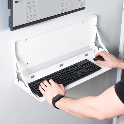 Wall-mounted flip down keyboard tray platform. Low profile design folds up and out of the way when not in use. Velcro included to keep keyboard in place. Fits a standard-sized keyboard and mouse (mouse pad included). Mount to drywall, wood studs, brick, or concrete.