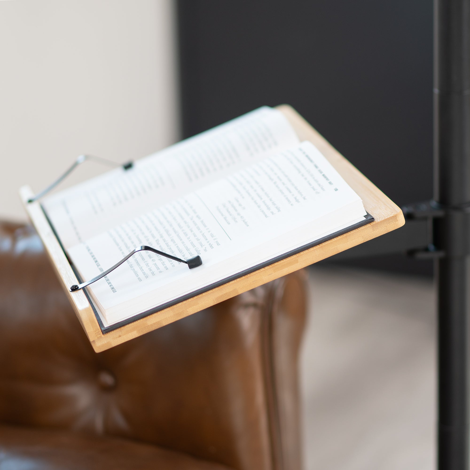 Mobile bamboo book stand with height adjustment and articulation.