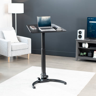 Sleek mobile foldable laptop desk with height adjustment and tilt. Can fold away to store behind furniture.
