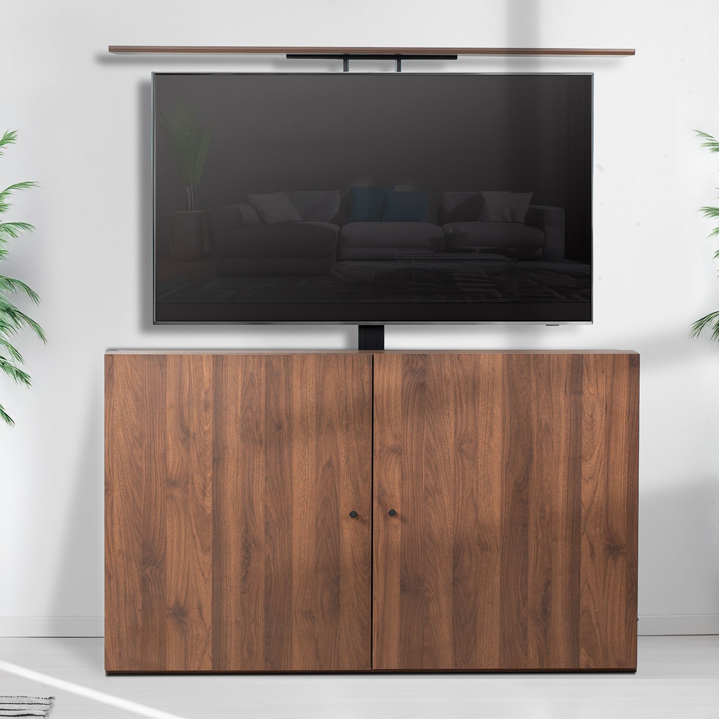 Wooden TV cabinet with a flat-screen TV mounted on it.