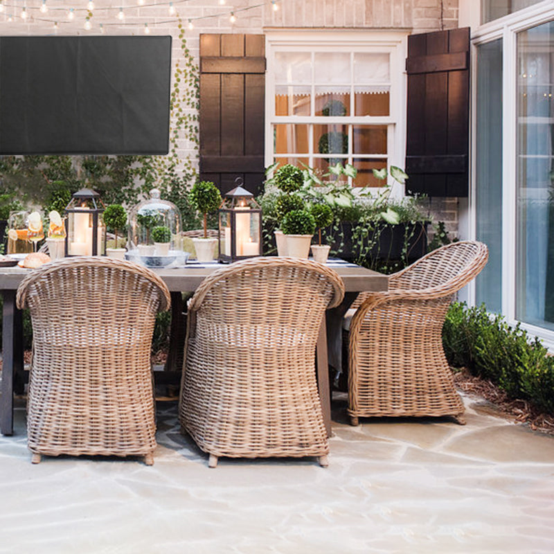 Protective flat screen TV cover in an outdoor patio area.