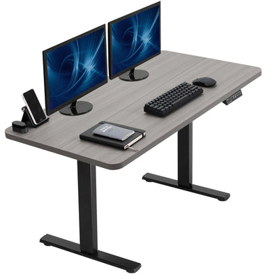Dark gray top with black frame desk with two monitors, keyboard, mouse, and phone on a white background.