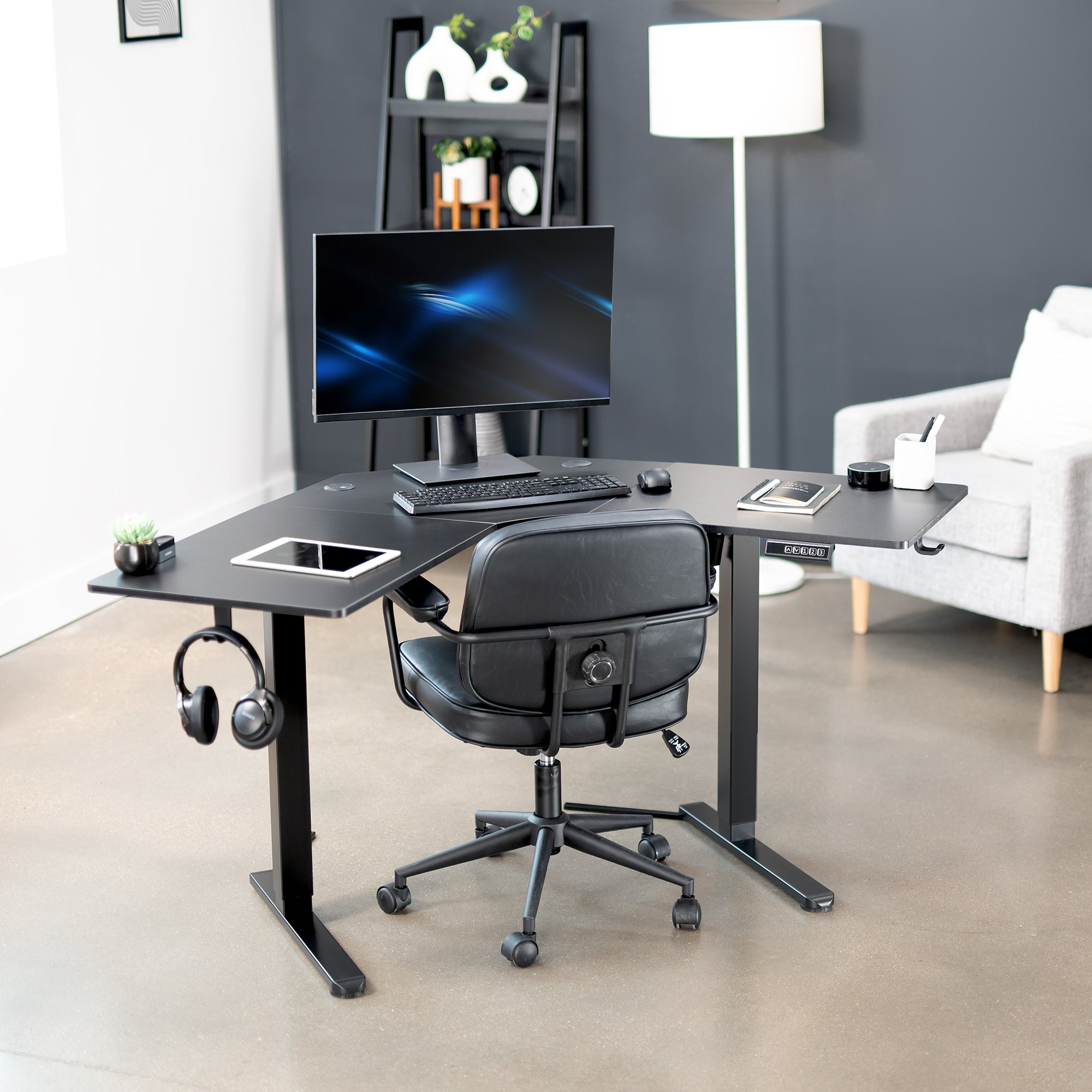 Heavy-duty electric height adjustable corner desk workstation for active sit or stand efficient workspace.