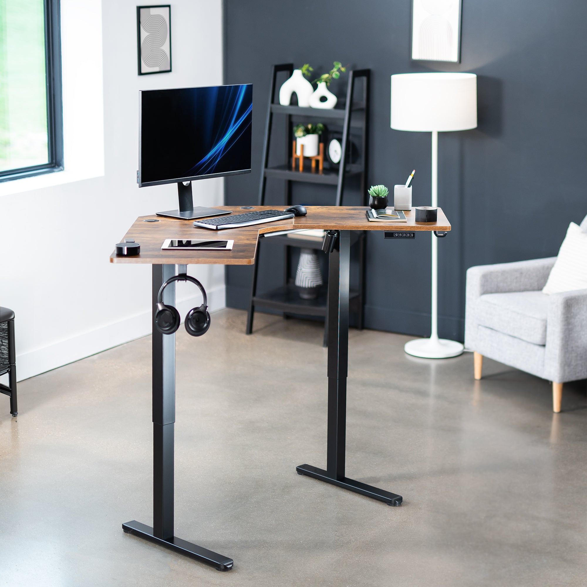 Heavy-duty electric height adjustable corner desk workstation for active sit or stand efficient workspace.