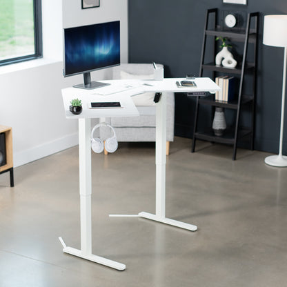 Heavy-duty electric height adjustable corner desk workstation for active sit or stand efficient workspace.