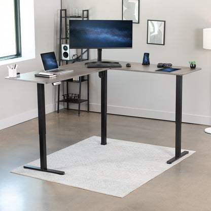 Electric heavy-duty corner desk workstation for modern office workspaces.