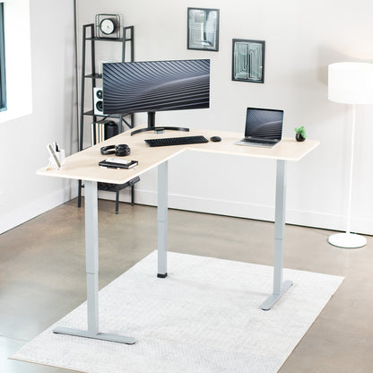 Electric heavy-duty corner desk workstation for modern office workspaces.