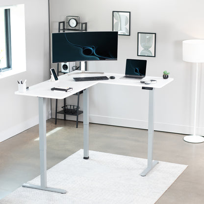 Electric heavy-duty corner desk workstation for modern office workspaces.