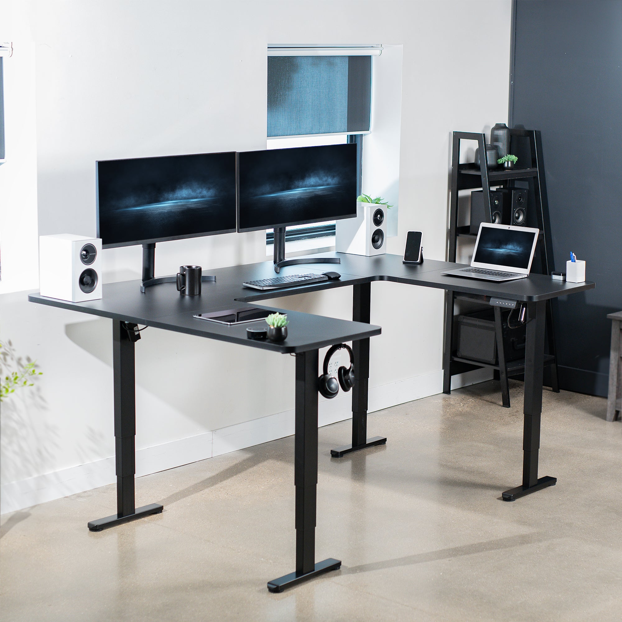 Heavy-duty spacious height adjustable U-shaped electric desk with programmable memory controller.