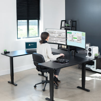 Heavy-duty spacious height adjustable U-shaped electric desk with programmable memory controller.