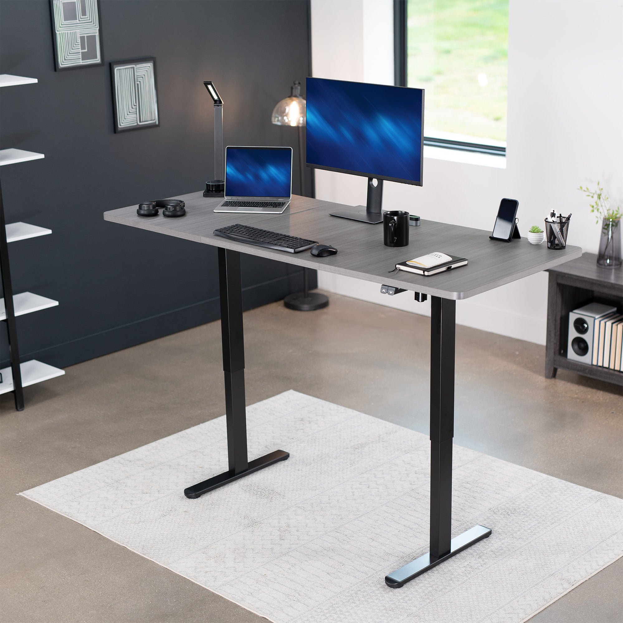 Wide surface sturdy sit or stand active workstation with adjustable height using 2 button control panel.