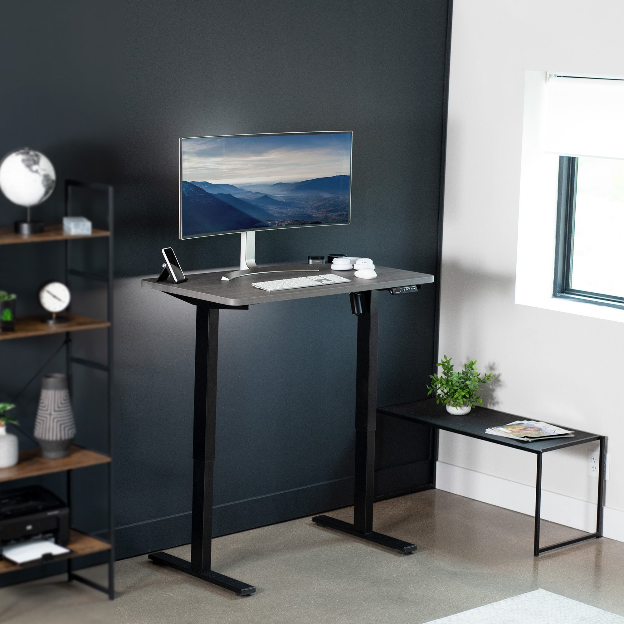 Sturdy ergonomic sit or stand active desk workstation with adjustable height using smart control panel.