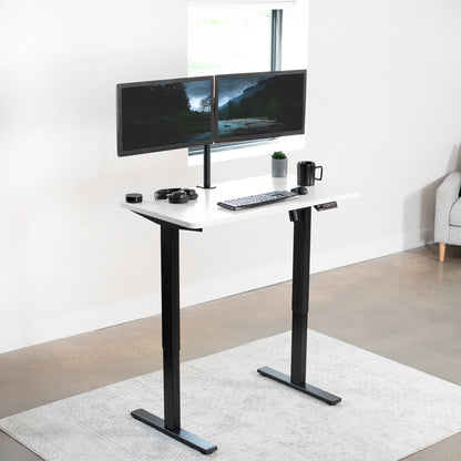 Sturdy ergonomic sit or stand active desk workstation with adjustable height using smart control panel.