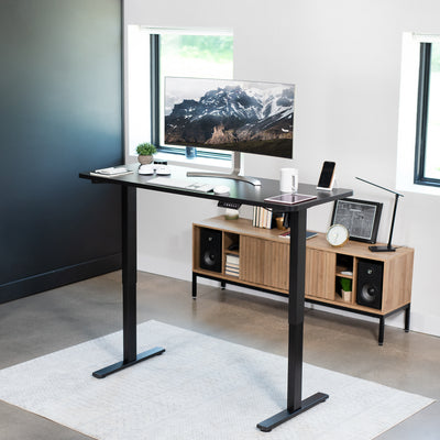 Extended height adjustable desk frame improving posture and increasing productivity.