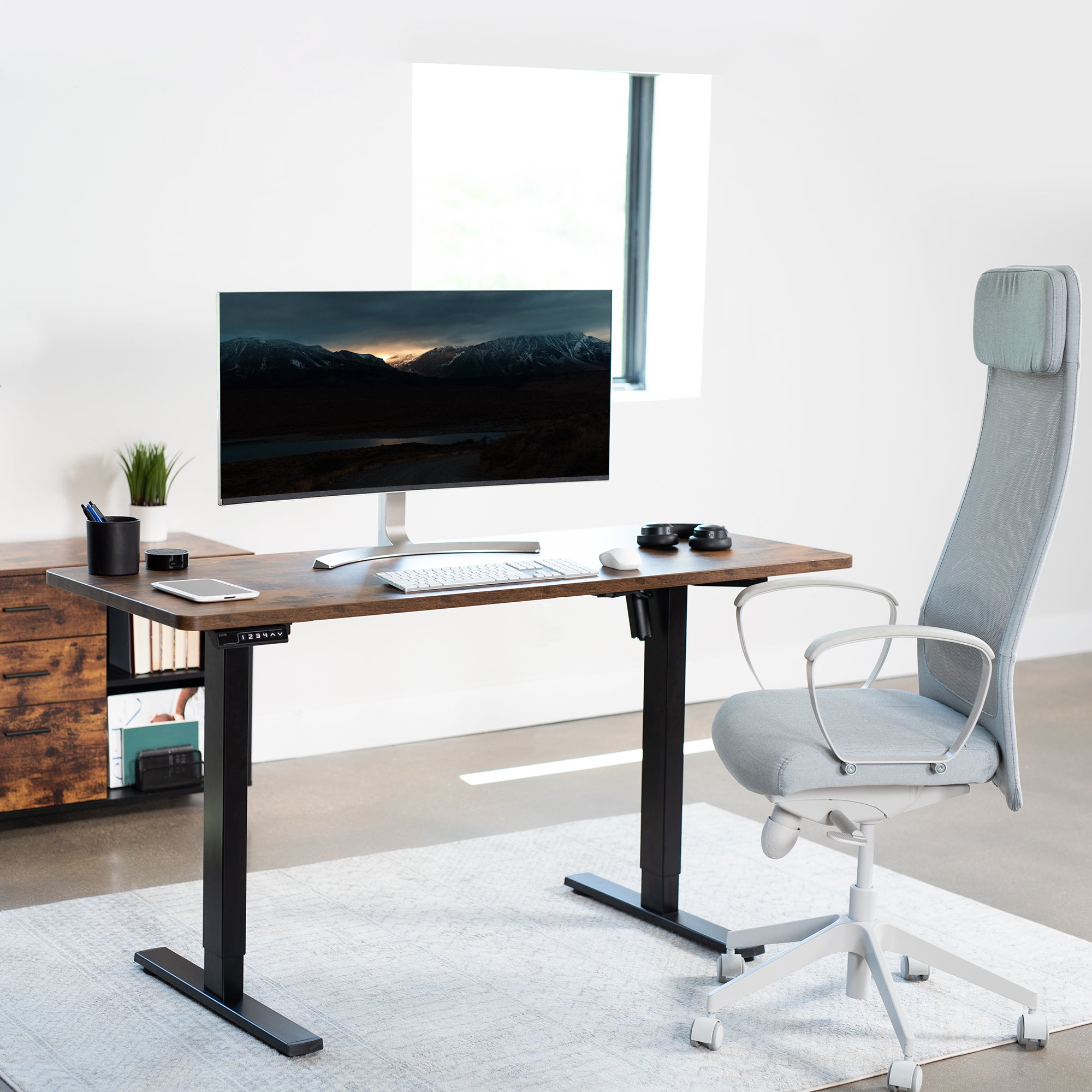 Rustic, sturdy ergonomic sit or stand active desk workstation with adjustable height using smart control panel.