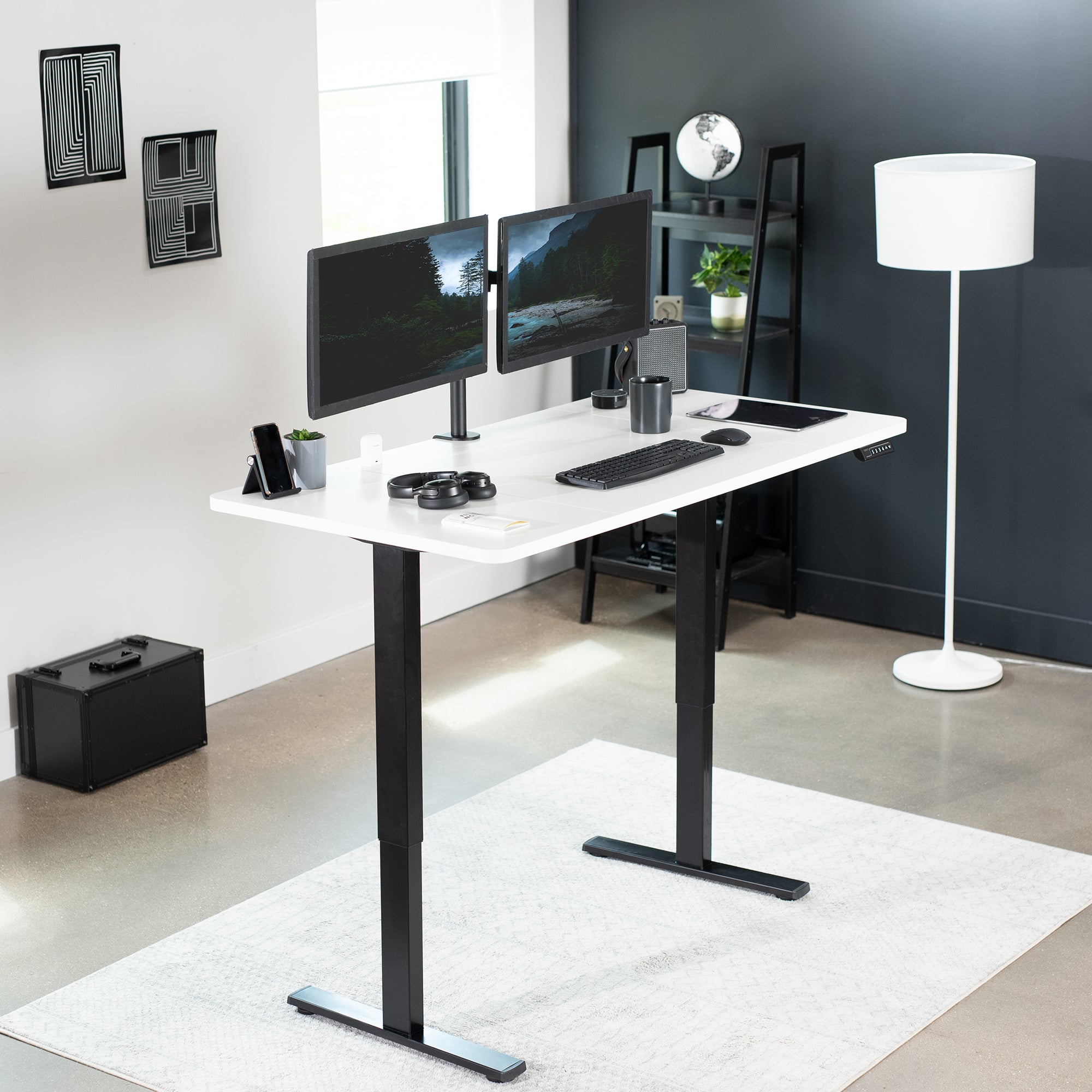 Sturdy ergonomic sit or stand active desk workstation with adjustable height using smart control panel.