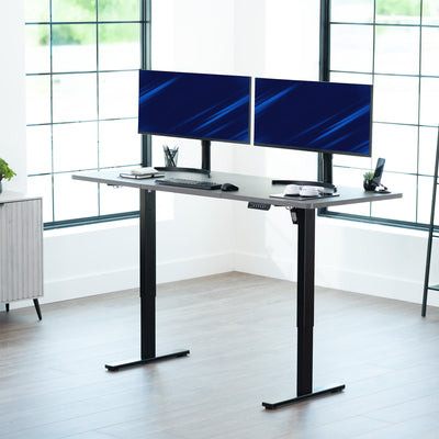 Large sturdy sit or stand modern desk with electric height adjustment options.
